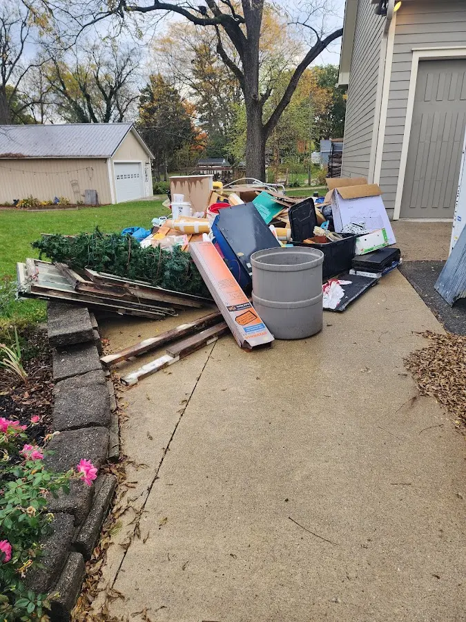 Dumpster being loaded with debris for Demolition Dumpster Rental in Lebanon